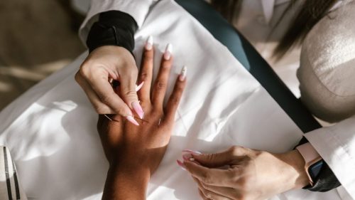 Close-up of hands during an acupuncture therapy session for holistic health and wellness.
